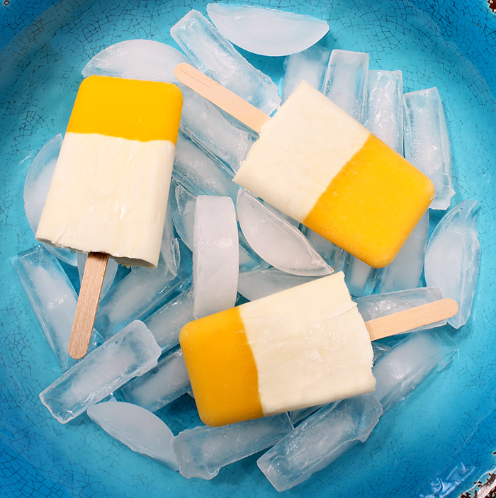 Mango Colada Pops from The Lean Clean Eating Machine are a healthy way for kids to cool down in the summer