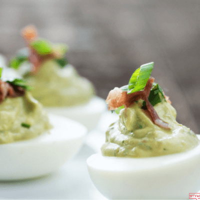 The Best Keto Deviled Eggs with Avocado: Low Carb Guacamole Stuffed Eggs with Bacon! This easy clean eating low carb appetizer recipe also makes a great keto snack! No mayo required in this keto deviled egg recipe that you can make spicy by adding Jalapeños! Perfect keto party appetizer that’s super easy & filling! 