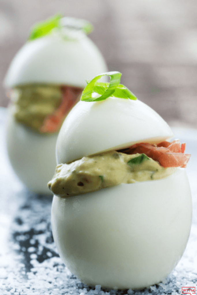 The Best Keto Deviled Eggs with Avocado: Low Carb Guacamole Stuffed Eggs with Bacon! The perfect Easter Appetizer! This easy clean eating low carb appetizer recipe also makes a great keto snack! No mayo required in this keto deviled egg recipe that you can make spicy by adding Jalapeños! Perfect keto party appetizer that’s super easy & filling!
