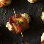 Need a keto appetizer recipe? You can’t go wrong with these bacon wrapped keto stuffed mushrooms! Easy low carb, high protein mushrooms filled with cream cheese, cheddar, and Parmesan & wrapped in bacon make fabulous finger foods for a crowd! Try this delicious keto stuffed mushroom appetizer at your next party! Nobody will guess it’s healthy keto diet food!