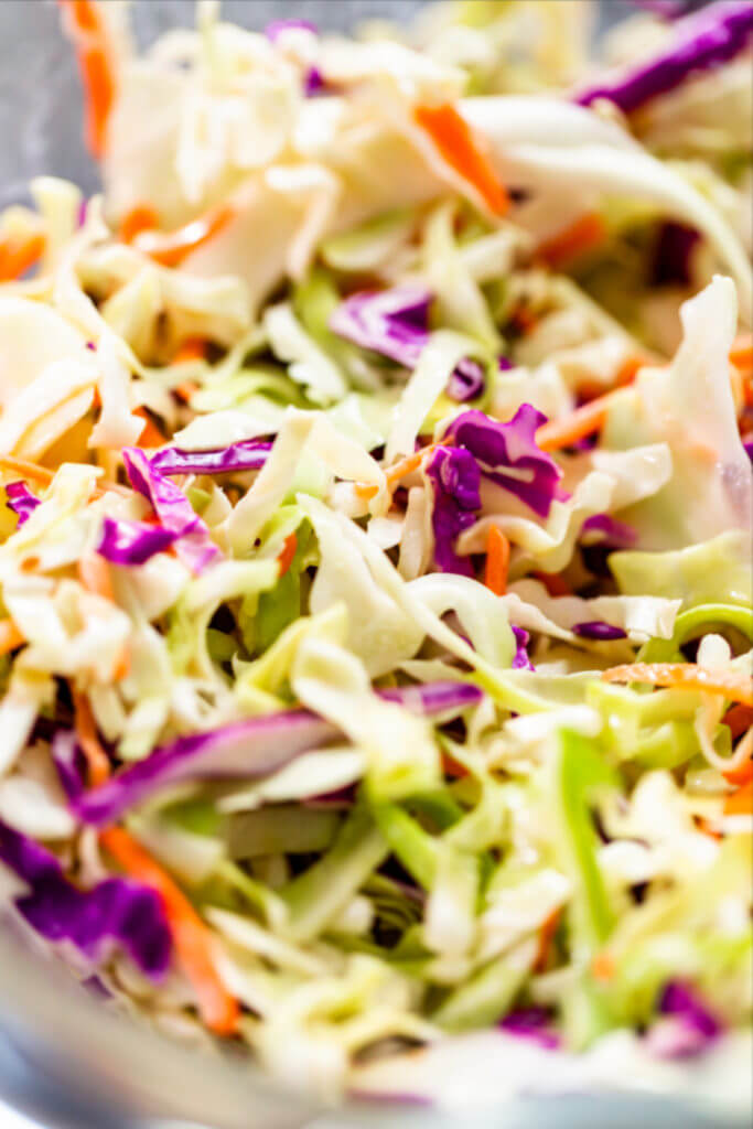 Memphis Style Keto Coleslaw [Low Carb, Sugar-Free] Pulled pork’s favorite low carb sidekick & summer salad! Creamy, classic low carb coleslaw recipe with Southern flavor & 3.2 net carbs! Try this homemade, sugar-free Memphis style coleslaw at your next BBQ or cookout! A delicious keto-friendly version of the traditional creamy coleslaw recipe! The must-have keto side dish for your low carb grill recipes this summer! #keto #lowcarb