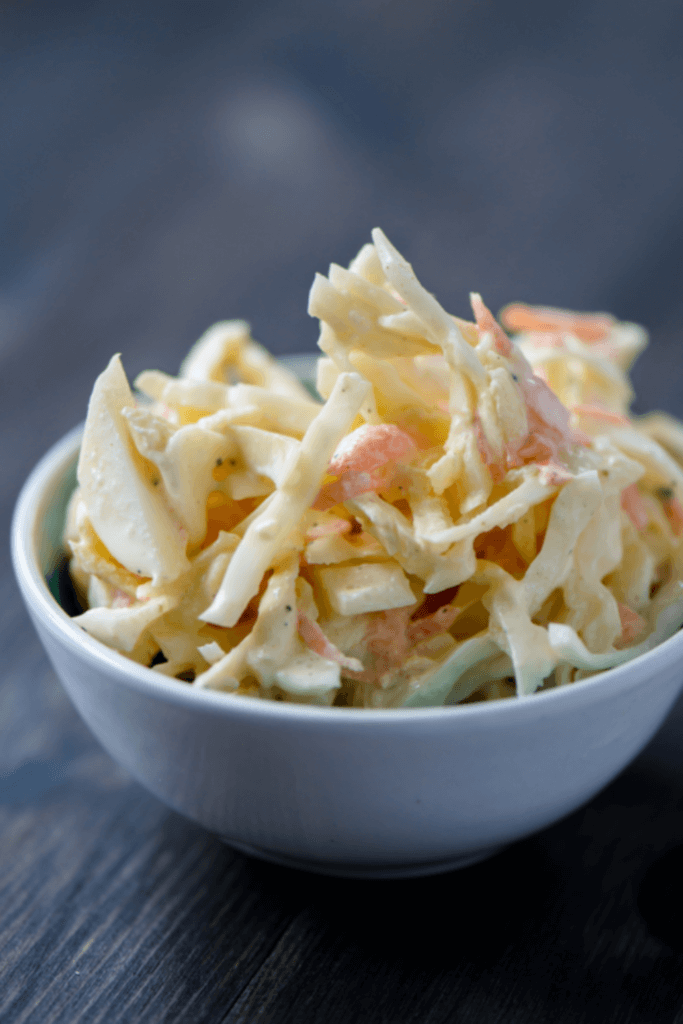 Sweet & Spicy Keto Coleslaw: 2 Ways To Make The Perfect Low Carb Slaw | The must have low carb, keto side dish for summer is this keto coleslaw recipe! With two easy recipes, one with mayo & one without, you can’t go wrong with this sweet & simple keto coleslaw with no sugar added! Sour cream, ranch seasonings, jalapenos & cilantro bring a flavorful kick to this healthy coleslaw recipe! #keto #ketorecipes #lowcarb #coleslaw #sidedish