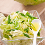 Sweet & Spicy Keto Coleslaw: 2 Ways To Make The Perfect Low Carb Slaw | The must have low carb, keto side dish for summer is this keto coleslaw recipe! With two easy recipes, one with mayo & one without, you can’t go wrong with this sweet & simple keto coleslaw with no sugar added! Sour cream, ranch seasonings, jalapenos & cilantro bring a flavorful kick to this healthy coleslaw recipe! #keto #ketorecipes #lowcarb #coleslaw #sidedish