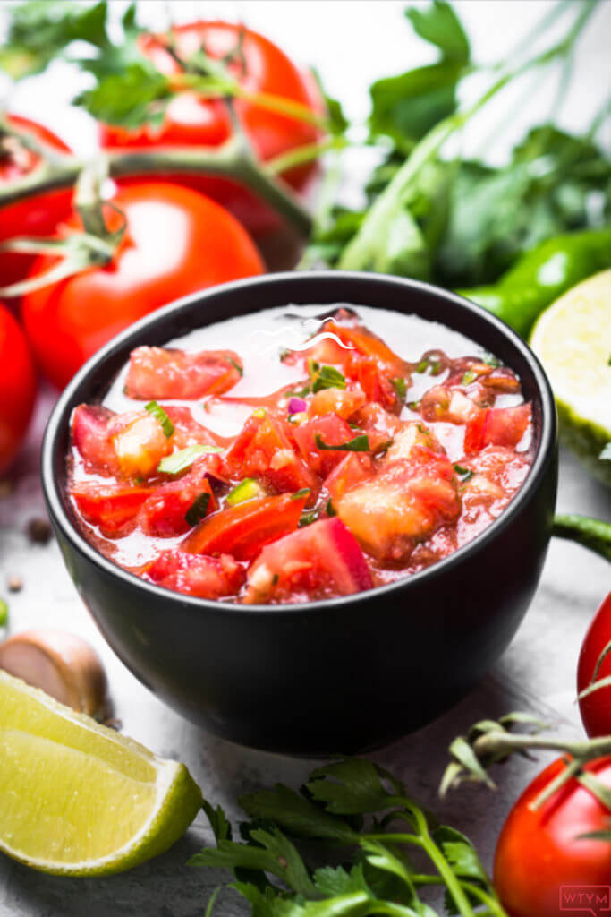Best Easy Homemade Blender Salsa | Made with fresh tomatoes this easy homemade salsa recipe comes together quick in the blender or food processor! Say goodbye to canned salsa & hello to healthy taco Tuesdays with an authentic tasting homemade salsa that’s low carb, gluten-free & clean eating! 
