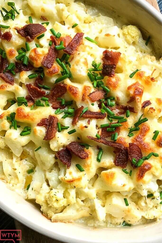Need an easy side dish? This Loaded Cauliflower Casserole is the best low carb keto side dish recipe for dinner! My kids love this cheesy cauliflower casserole with bacon! If you’re looking for a new easy keto recipe for dinner or the holidays don’t miss this simple side dish! #sidedish #side #cauliflower #holiday #keto #ketorecipes #lowcarb #casserole #comfortfood