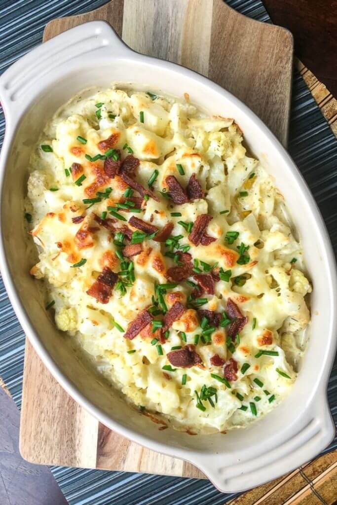 Need an easy side dish? This Loaded Cauliflower Casserole is the best low carb keto side dish recipe for dinner! My kids love this cheesy cauliflower casserole with bacon! If you’re looking for a new easy keto recipe for dinner or the holidays don’t miss this simple side dish! #sidedish #side #cauliflower #holiday #keto #lowcarb #casserole #comfortfood
