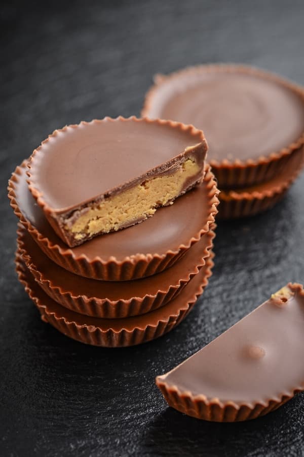 Keto Chocolate Peanut Butter Fat Bombs! If you’re looking for an easy low carb keto dessert recipe or snack these low carb fat bombs are the best dairy-free recipe ever! It doesn’t get easier than these peanut butter, chocolate and coconut oil fat bombs! Make these no bake treats ASAP if you love healthy, guilt-free, sugar-free peanut butter cups! #keto #ketorecipes #lowcarb