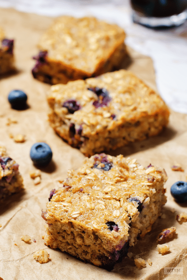 Clean Eating Blueberry Oatmeal Breakfast Bars (Vegan, Gluten-Free) If you’re looking for a healthy breakfast recipe to start your mornings and help you lose weight check out this simple breakfast idea you can make ahead and enjoy on the go! These clean eating blueberry oatmeal breakfast bars with banana are gluten-free, vegan, freezer-friendly and kid approved with no added sugar! #healthy #healthyfood #sugarfree #breakfast #healthybreakfast #under300calories #cleaneating #vegan