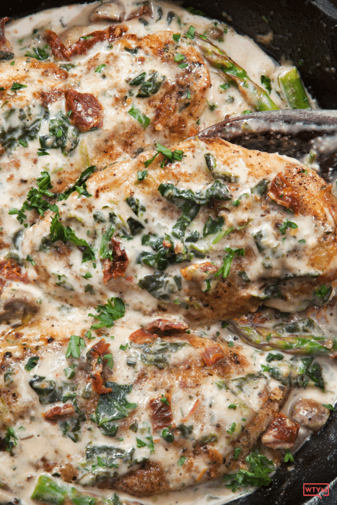 This easy keto crockpot chicken recipe makes the perfect low carb family dinner! Creamy Tuscan Garlic chicken with spinach is a healthy, family favorite with only 15 minutes of prep time!