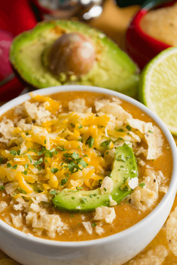 Looking for a keto dinner recipe that’s low carb high in flavor & easy to prep for the crockpot? This Keto Crockpot White Chicken chili is the best! Only 6 carbs & easy to make ahead & freeze! Everyone will love this easy keto recipe that’s perfect for ketogenic diet beginners-no special ingredients necessary! You can’t beat a slow cooking keto meal made easy in the crockpot! Yum! #keto #ketorecipes #lowcarb #LCHF #crockpot #crockpotrecipes